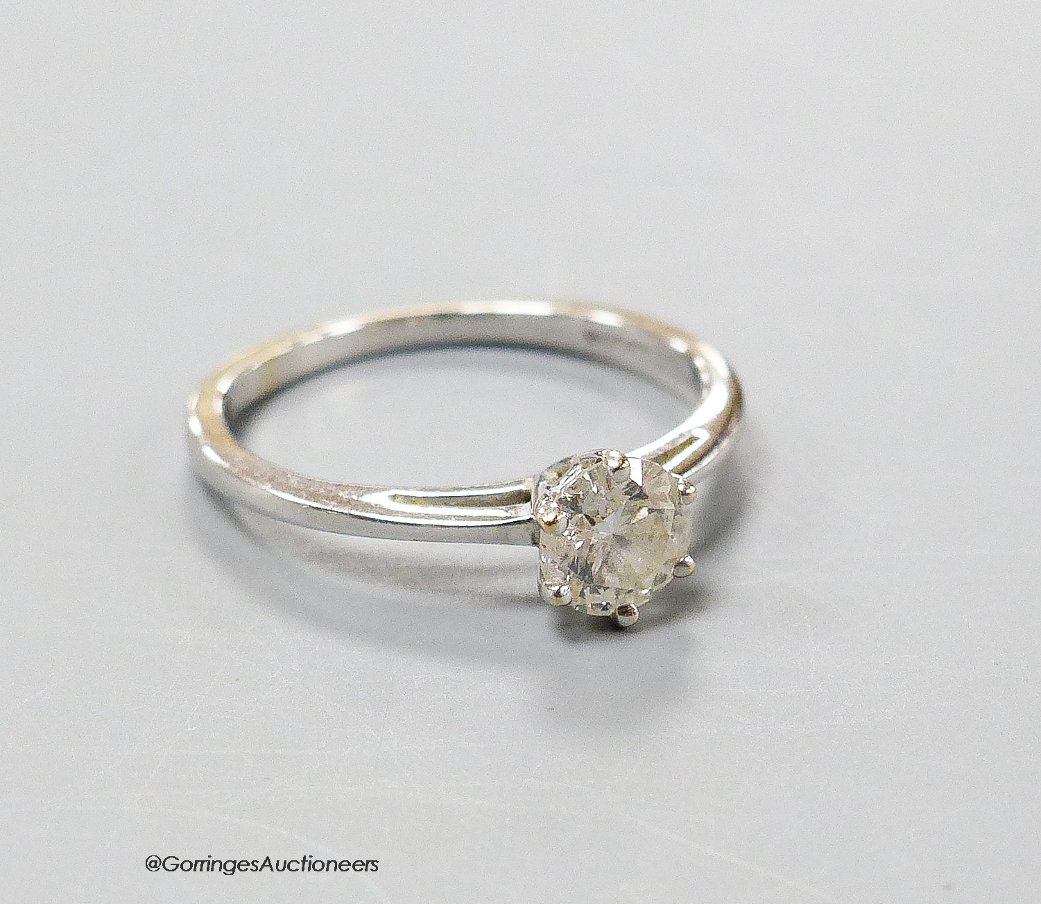 An 18ct white gold and solitaire diamond ring, size K/L, gross 2.2 grams.